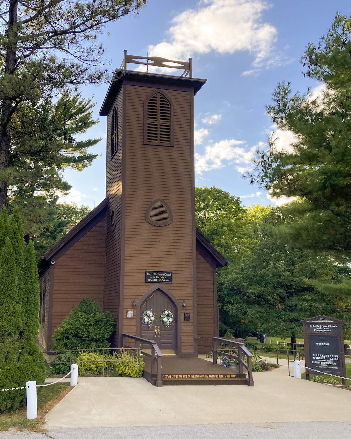 front of the little brown church