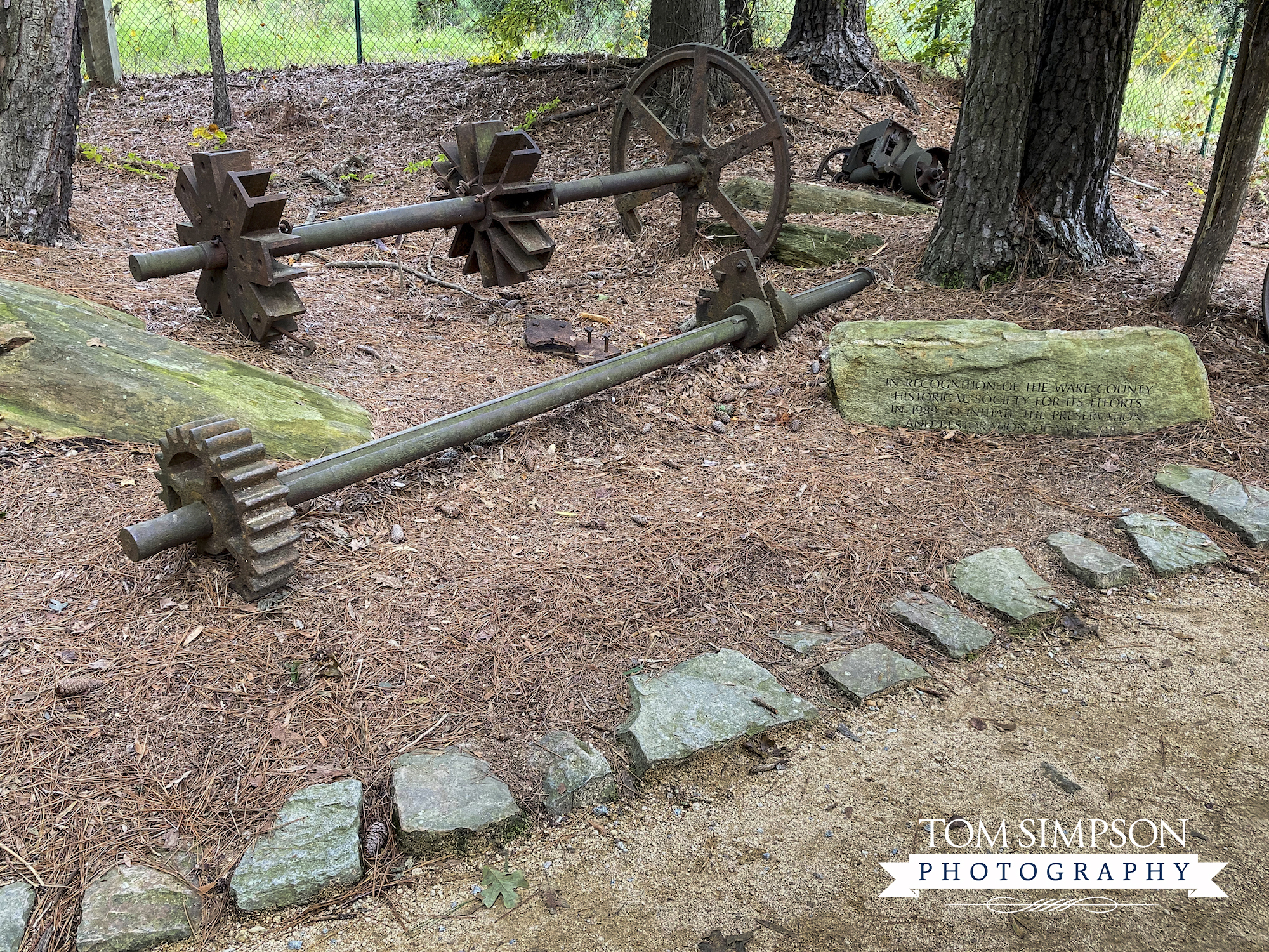 entrance path lined with old machinery