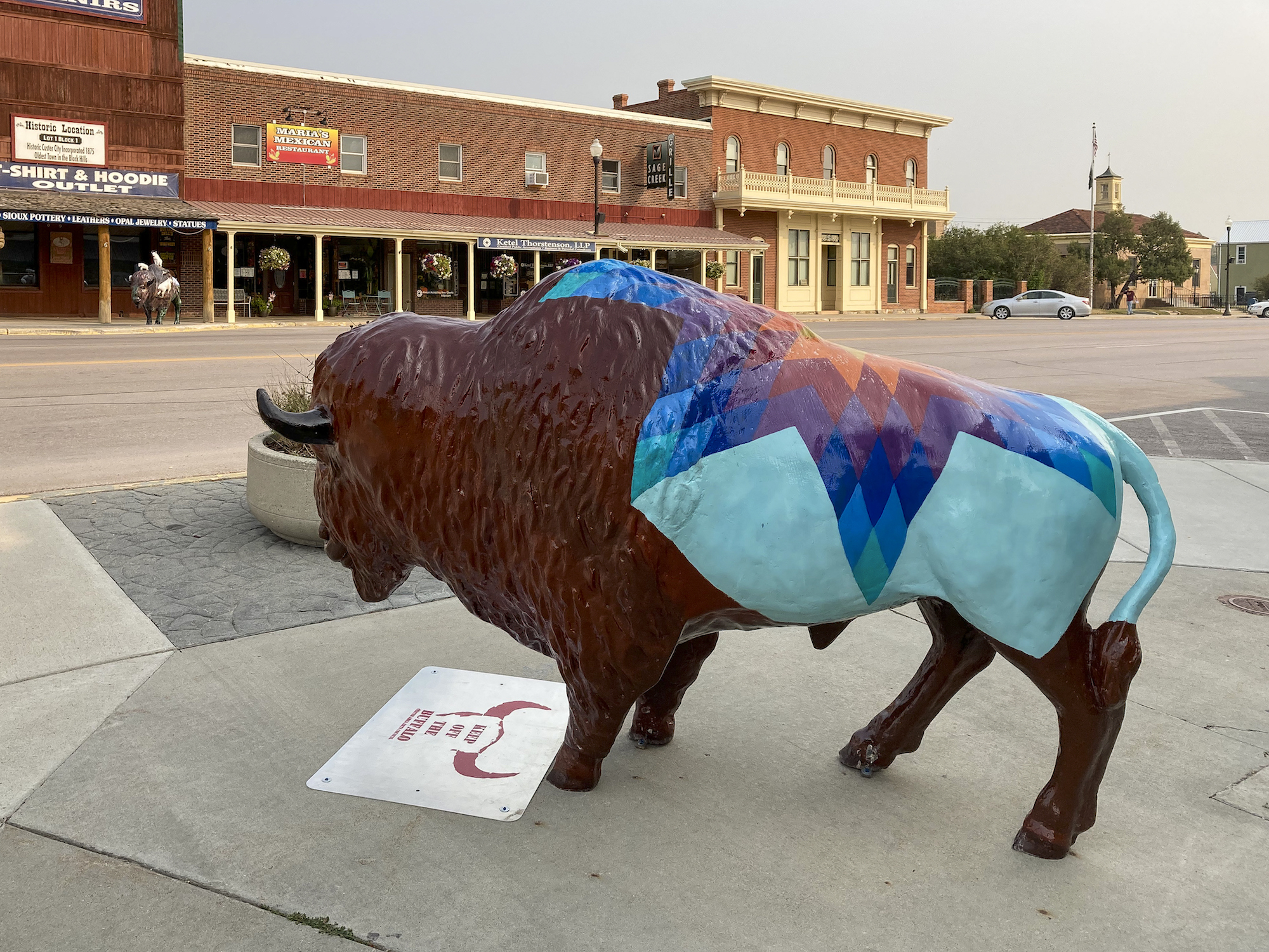 local artist paints buffalo statues