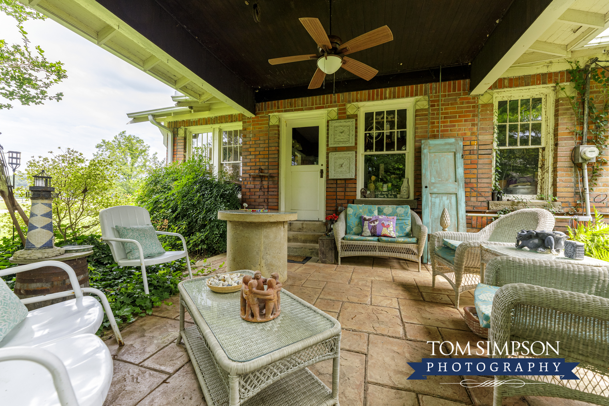 guests find wicker seating on the porch