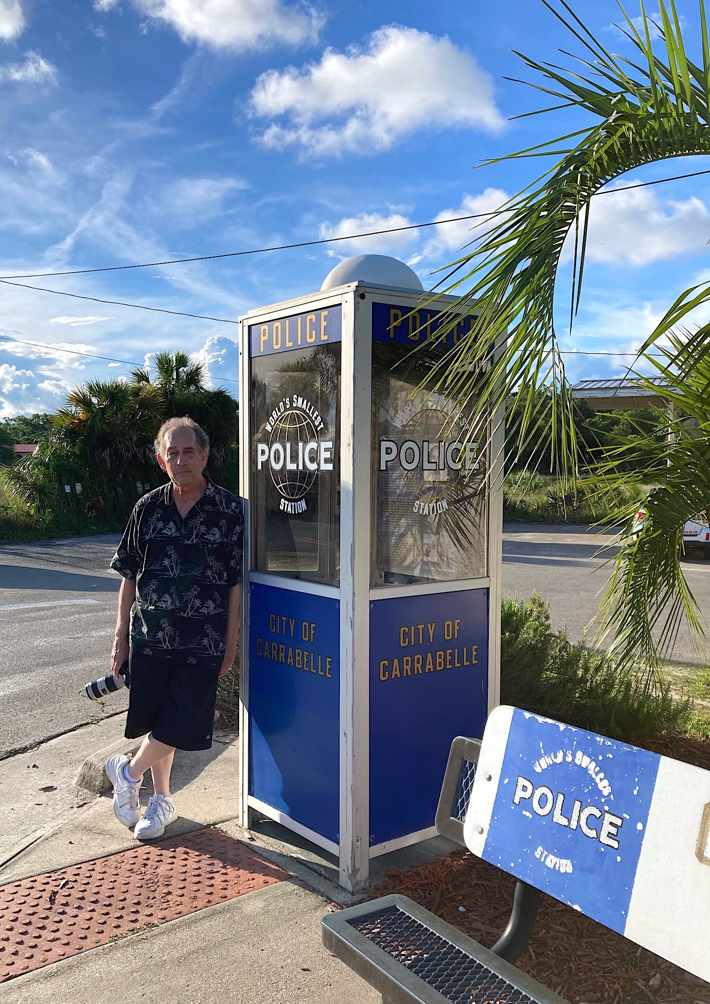 photographer beside phone booth police station