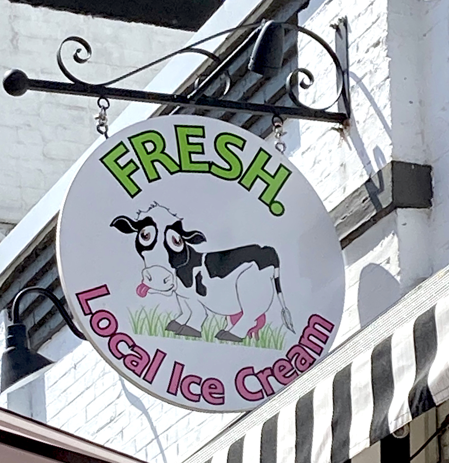 cow caricature in store logo