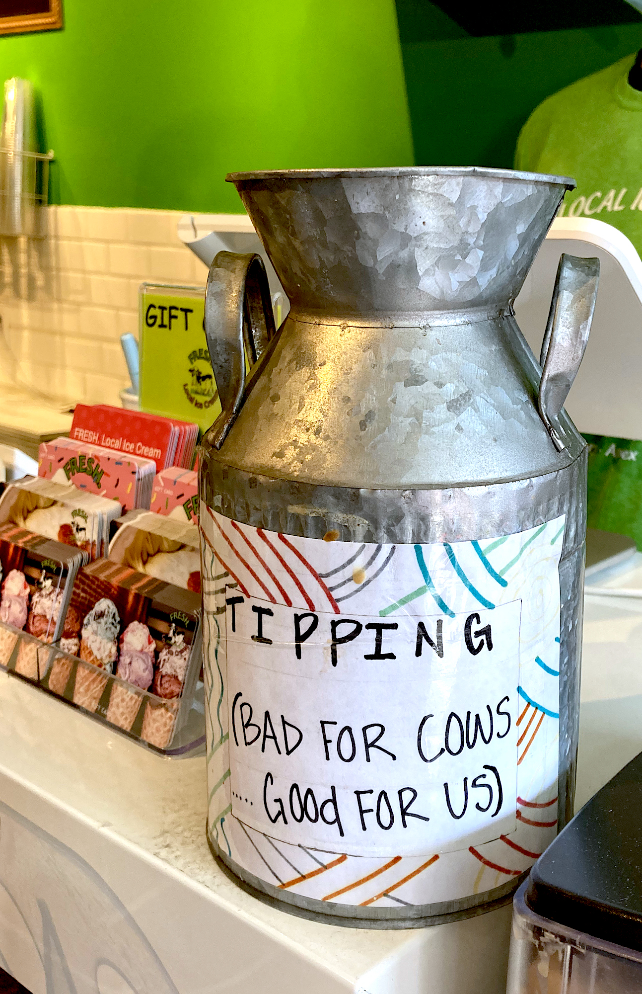 small metal milk can for tips in family-owned business