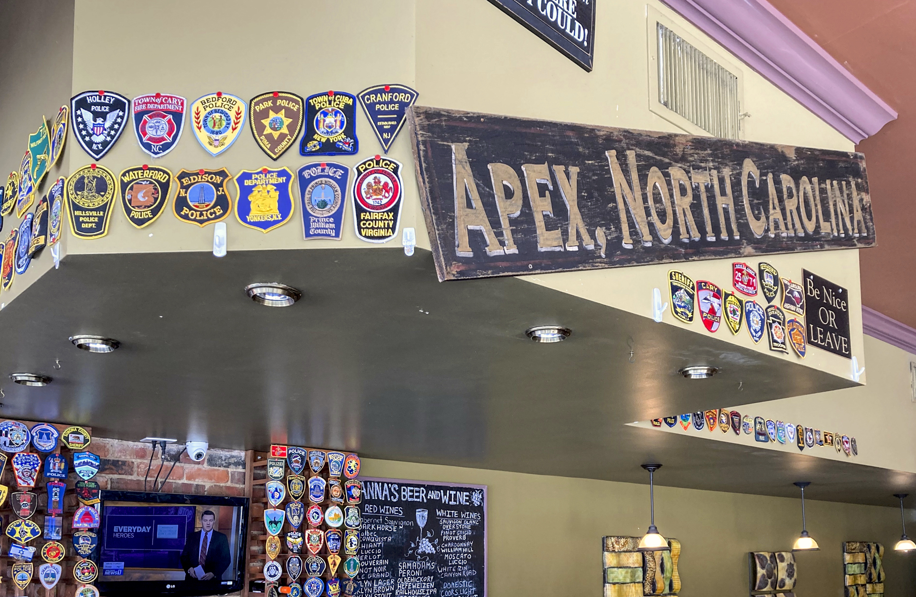 police patch display at pizza place