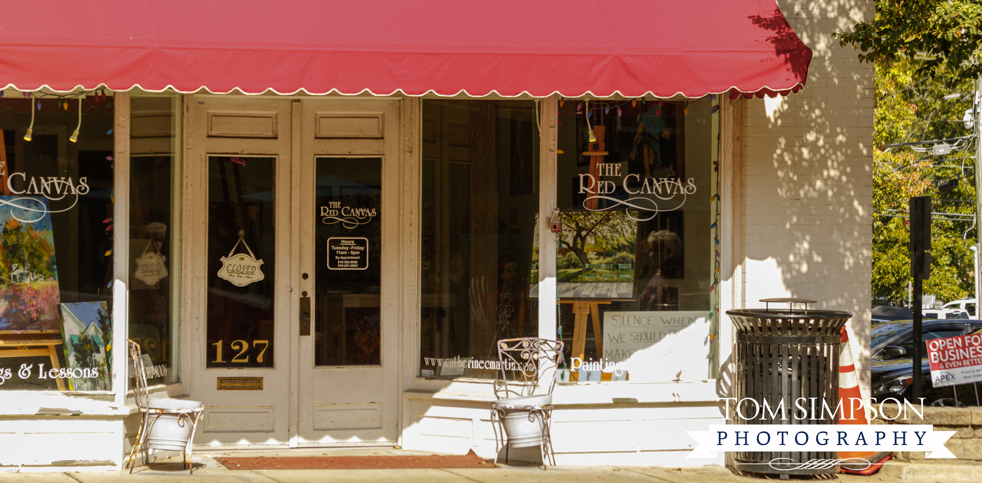 historic storefront with bright red awning